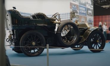 Profile of a Mercedes 60HP on a blue carpet at Rétromobile 2024