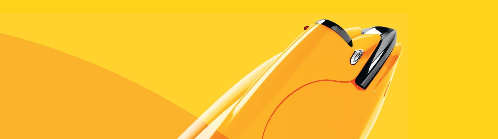 banner-format visual showing the front of a DS against a background of yellow and orange circles