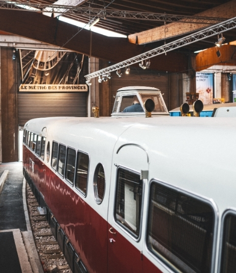 red and white Bugatti train in a station