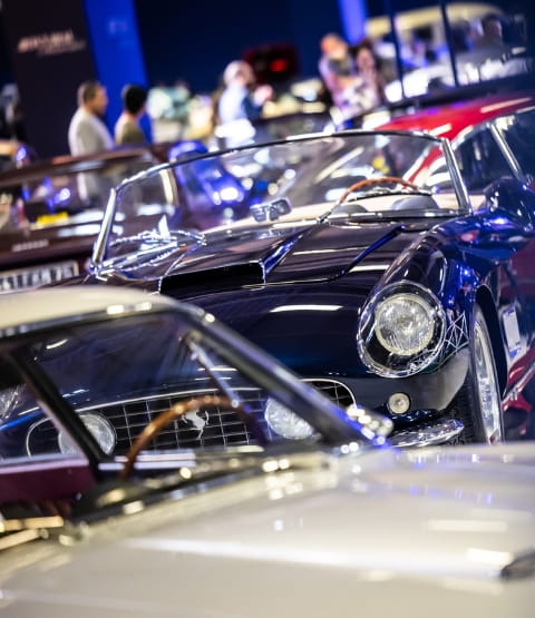 shiny collector cars in a show