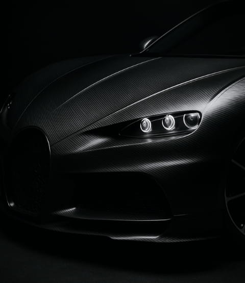 Black Koenigsegg car on black background
